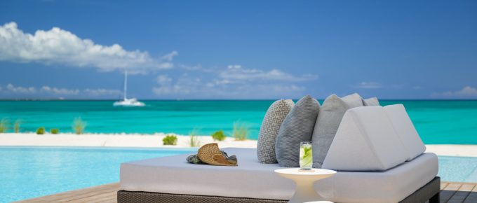 Spa bed beside outdoor pool for a wellness retreat
